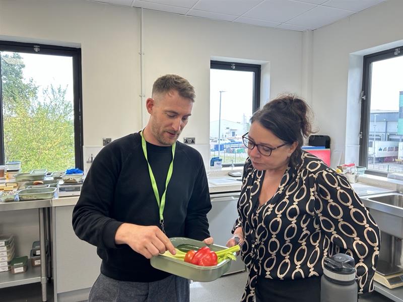 Ben Davies NPD with manager discussing food in the test kitchen
